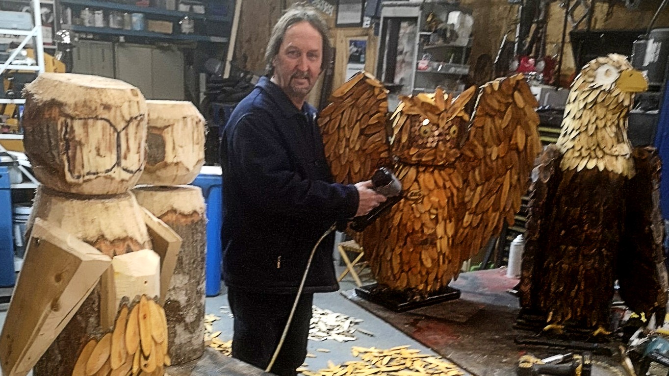 Calvin McKay tends to four sculptures in his workshop. The finished and standing owl is named Lill after his mother, and he plans on giving the large eagle away to a friend. Lill will join Owlvin and McEagle on the trail soon. 