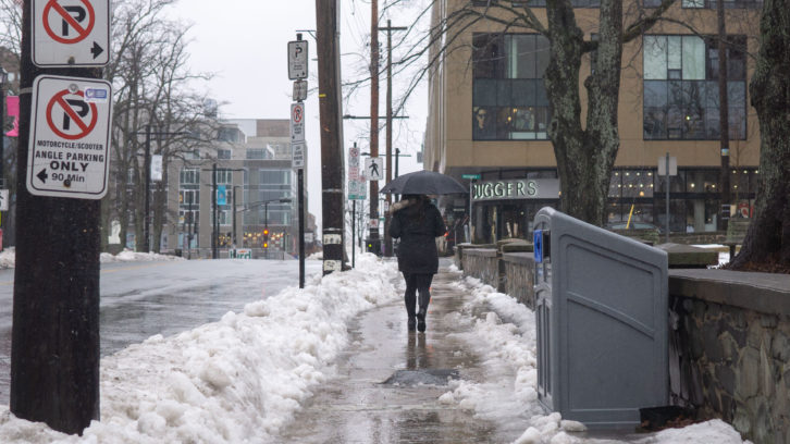 The city advised residents to be careful commuting on icy sidewalks as a freezing rainstorm hit the city on Friday. 