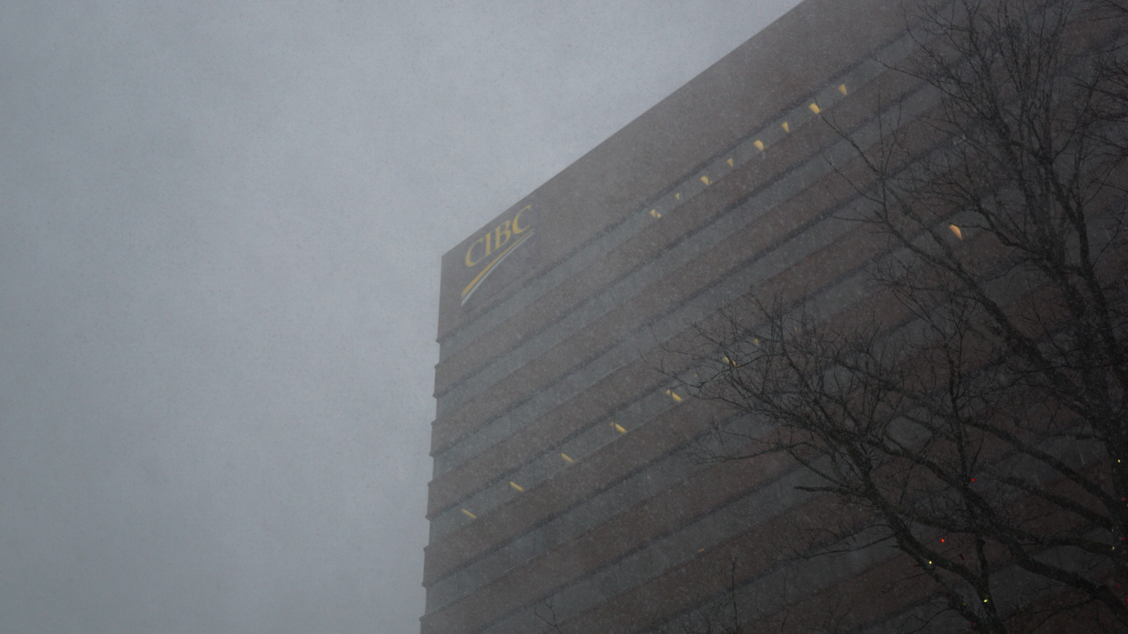 The CIBC building in downtown Halifax is seen through snow.