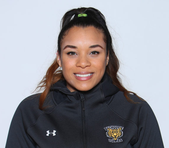Portrait of Marika Williams wearing a black sweatshirt with the Dalhousie Tigers logo embroidered on it.