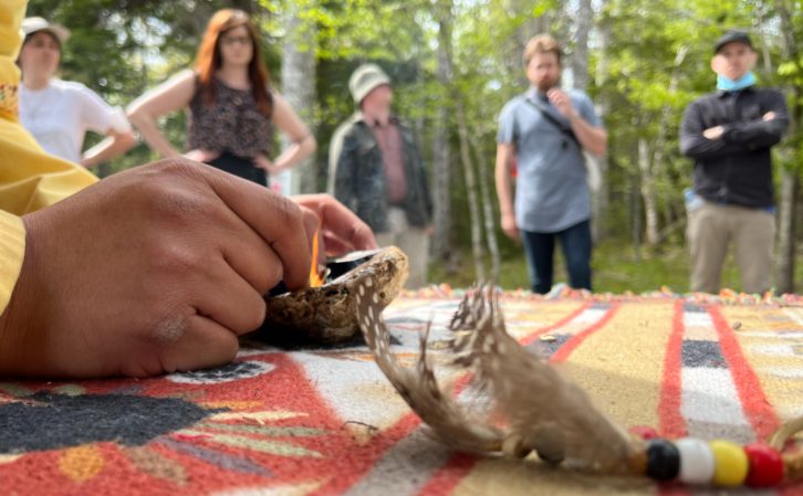 Students learn the significance of smudging to Mi'kmaq.