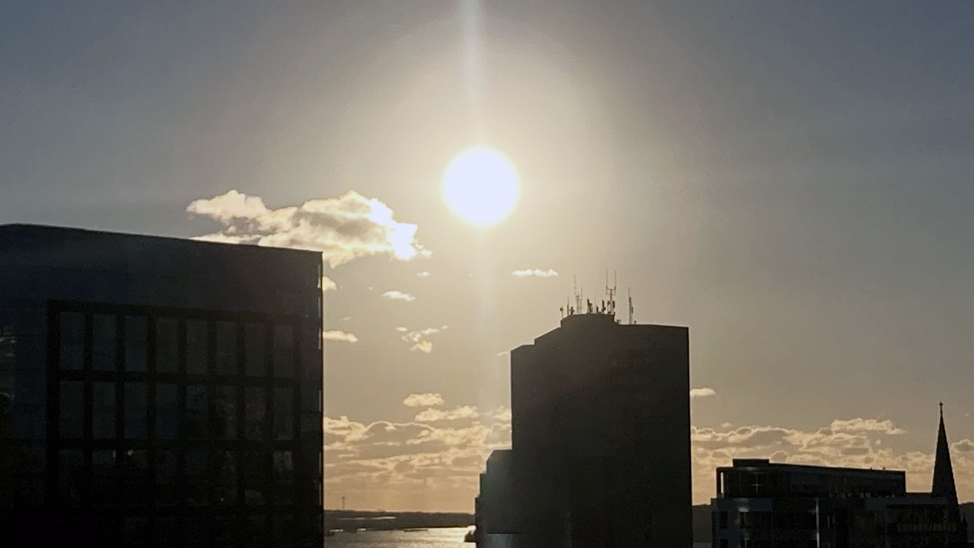 The sun rises over the downtown Halifax and the Halifax Harbour.