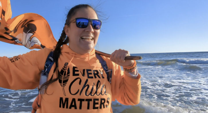 Jasmine Lavallee celebrates the end of a 3,200-kilometre walk from Winnipeg that ended at Conrad's Beach NS on Monday, Dec. 5. The walk was to raise awareness about residential-school victims.