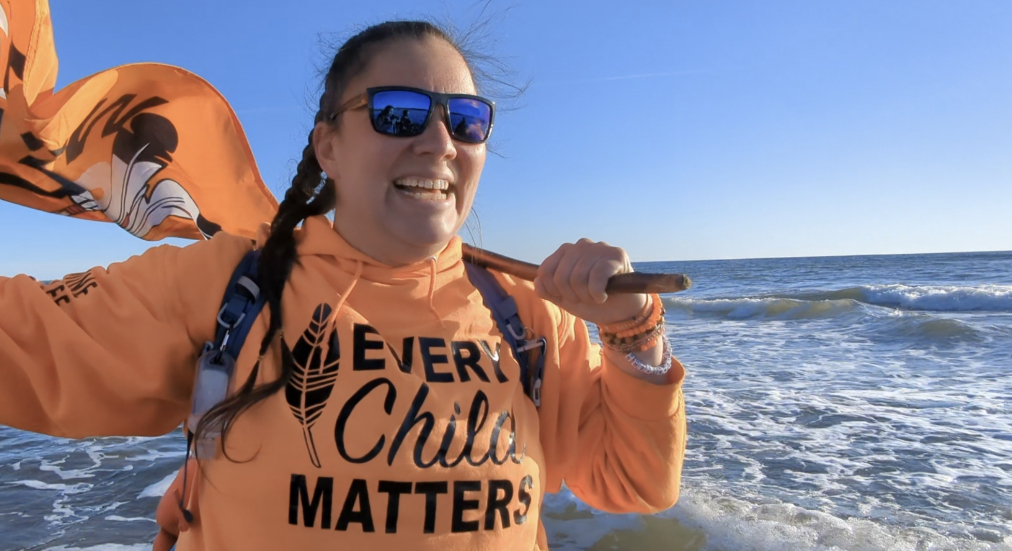 Jasmine Lavallee celebrates the end of a 3,200-kilometre walk from Winnipeg that ended at Conrad's Beach NS on Monday, Dec. 5. The walk was to raise awareness about residential-school victims.