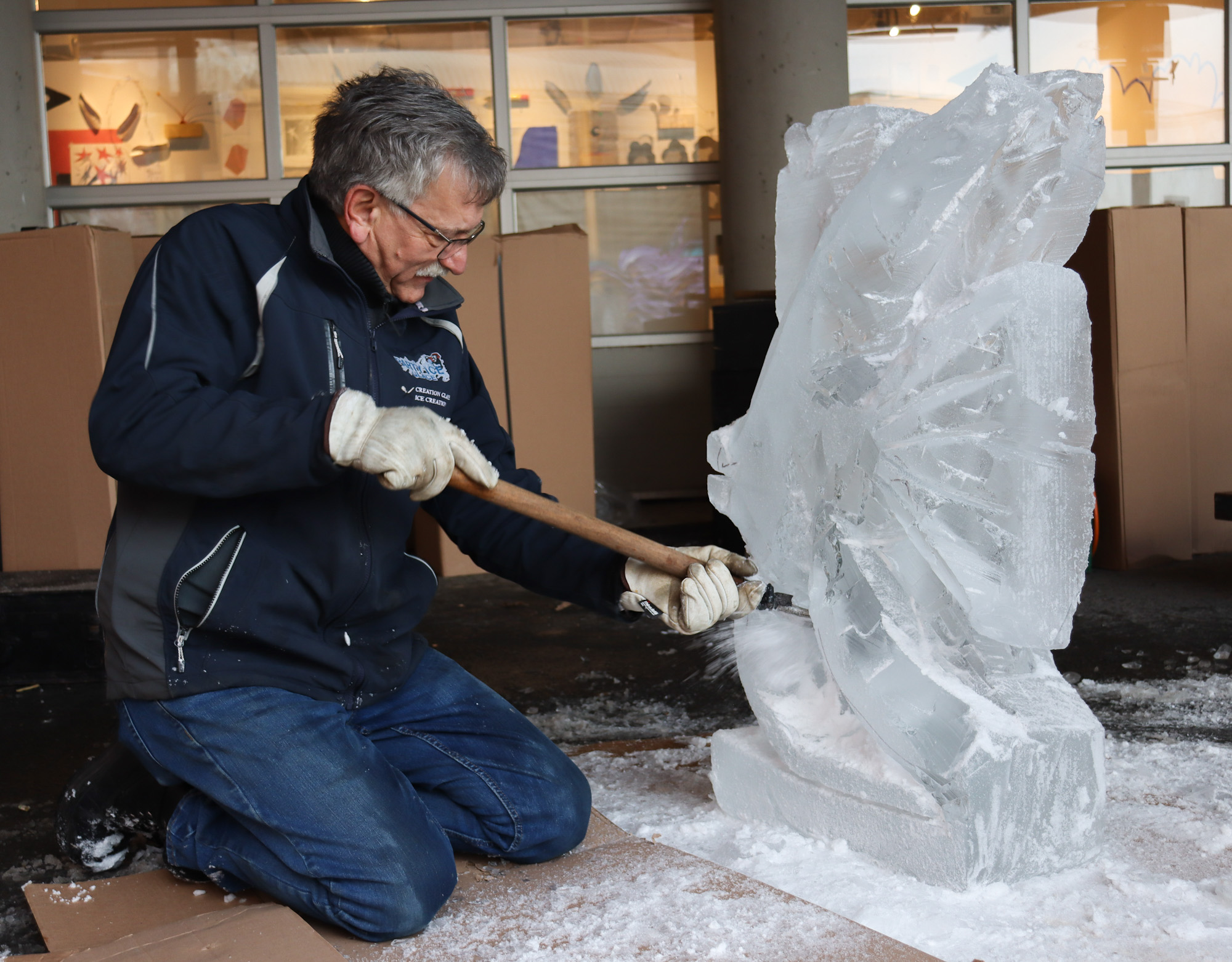 Ice carver and chef Richard Chiasson chisels details into a sculpture during a workshop at Alderney Landing for the 2023 Downtown Dartmouth Ice Festival  on Jan. 27.