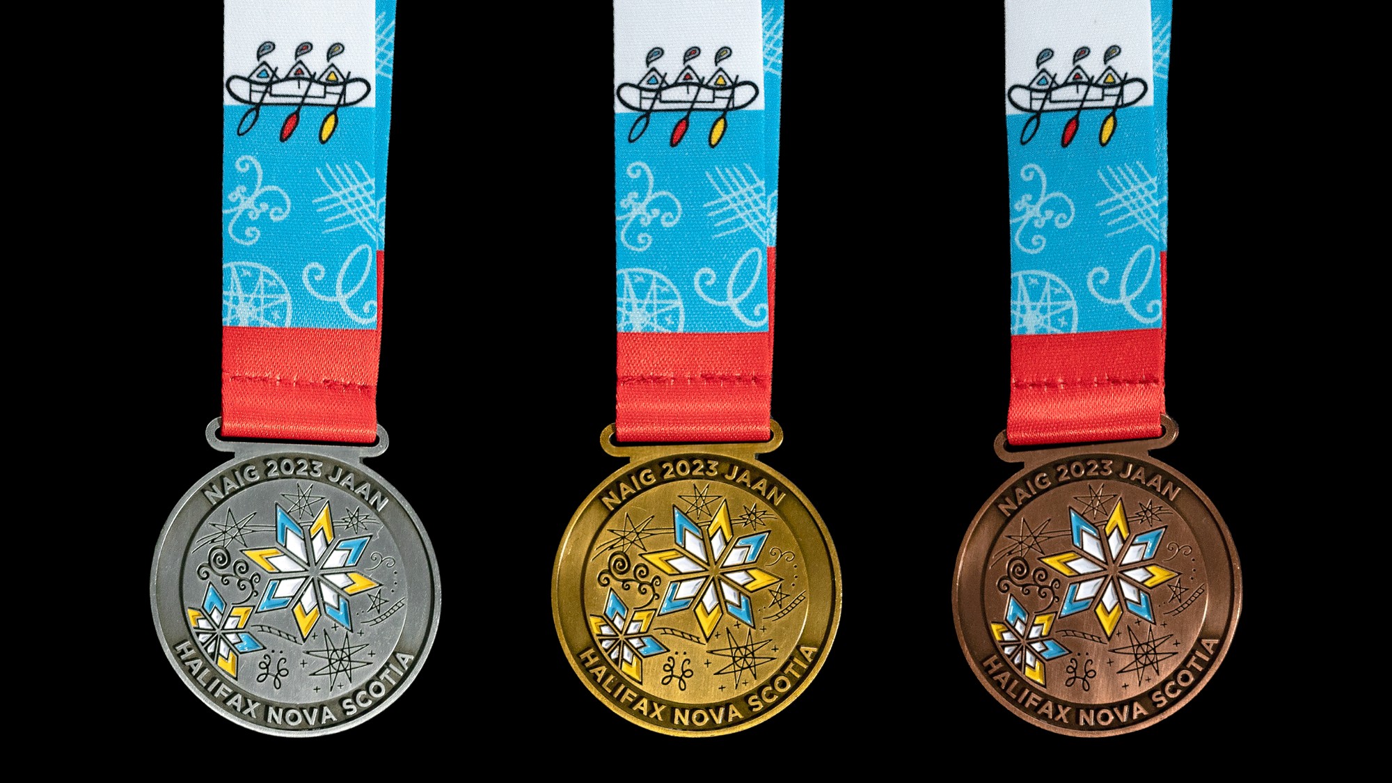 Gold, silver and bronze medals designed by Ella Scothorn and Tayla Fern Paul were revealed at a  media conference on Tuesday at Millbrook First Nation. This event marked the six-month countdown to the 2023 North American Indigenous Games in July. Photo: NAIG 