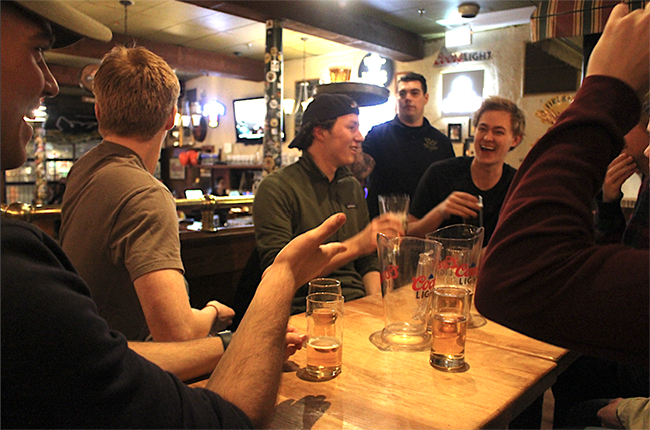 Guys drinking at a bar in Halifax