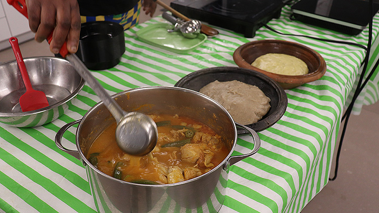 Mary Nkrumah prepared steaming soup (l) and two kinds of fufu (r). She taught workshop participants how to make the meal, then she served it for sampling.