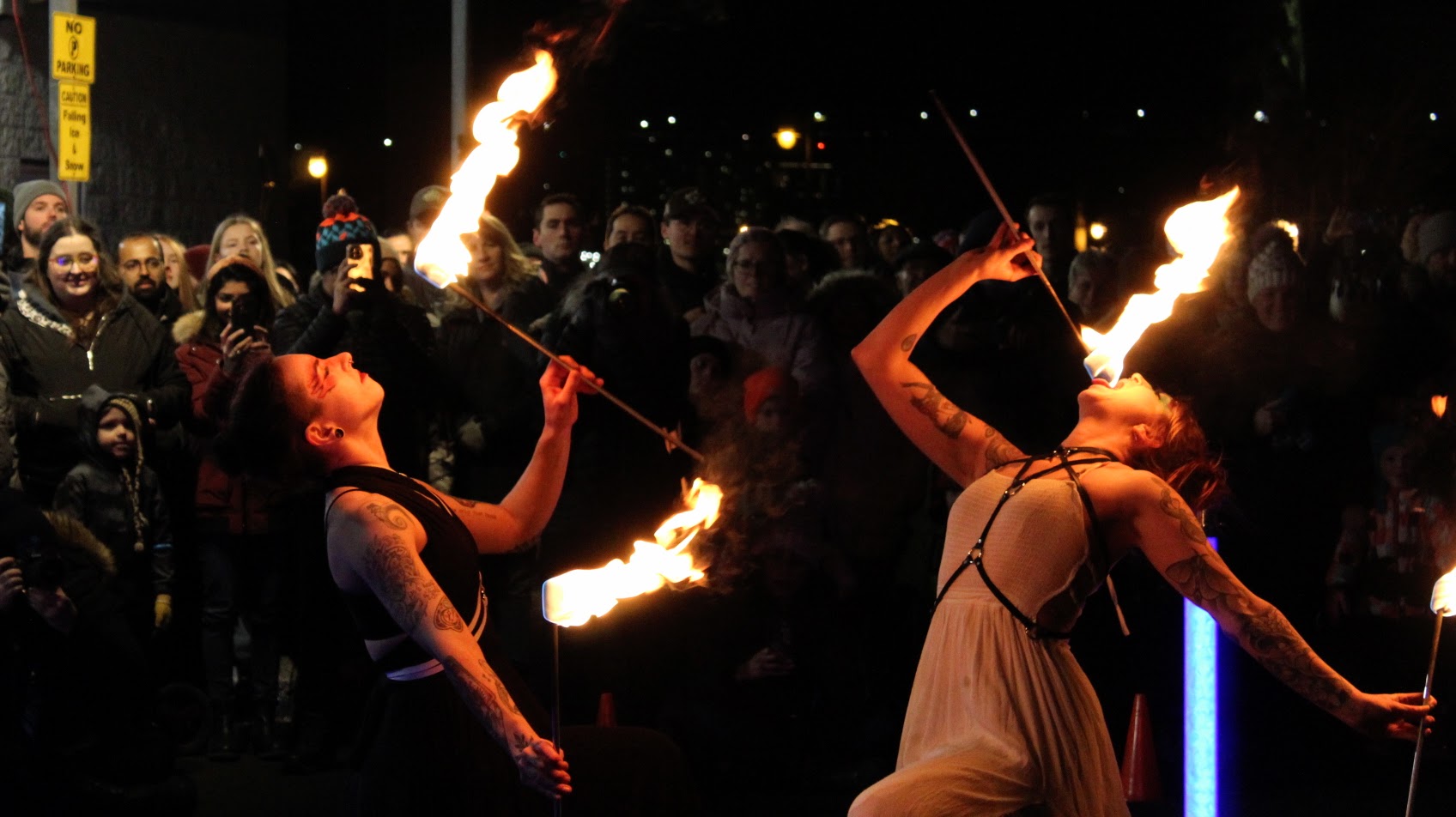 Mizz Anthrope (l) and Lumen Lux (r) perform at the Downtown Dartmouth Ice Festival at Halifax’s Alderney Landing on Jan. 28, 2023. They have trained for years to become fire performers.