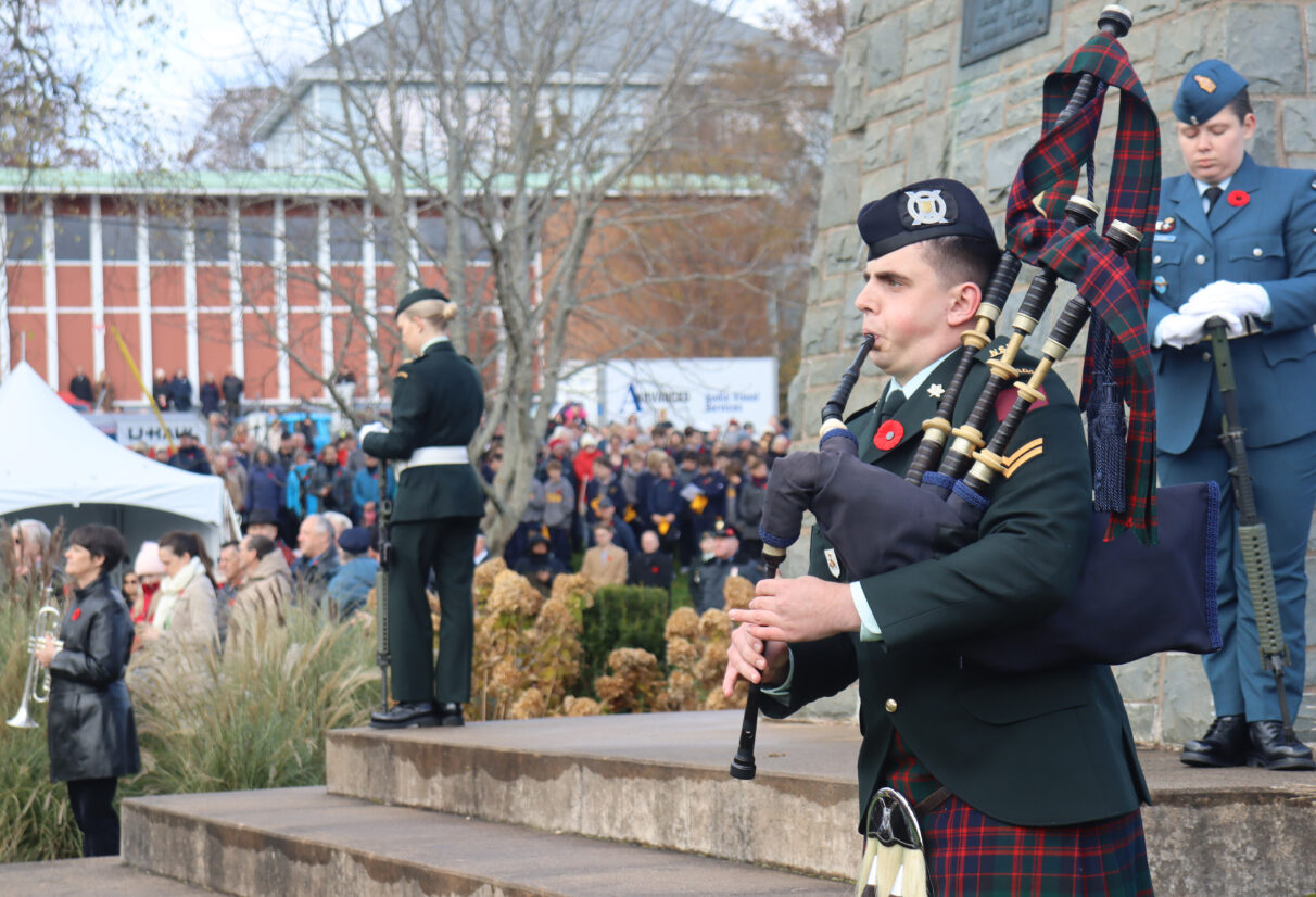 A soldier plays the bagpipes during the two minutes of silence at Sullivan's Pond in Dartmouth, N.S.