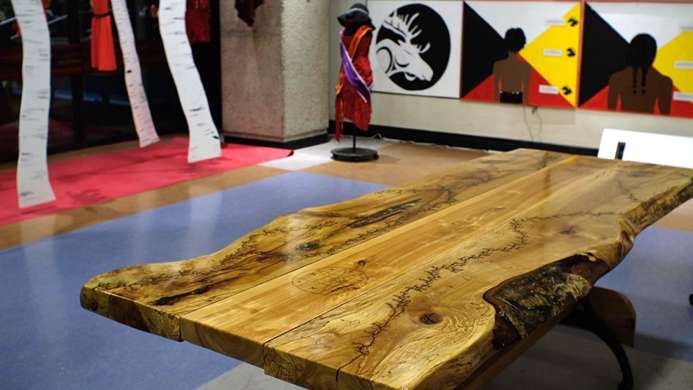 Table in gallery displaying Indigenous art