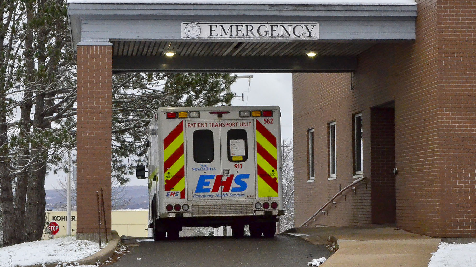 An ambulance is parked outside of the Digby General Hospital emergency room.