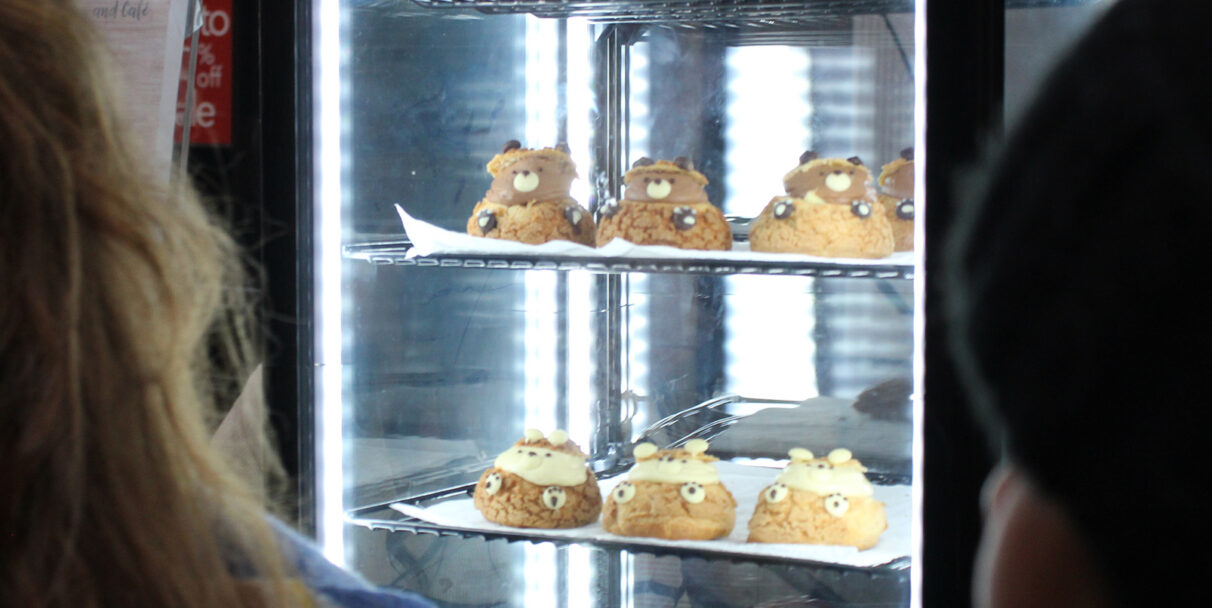 Pastries inside a refrigerator.