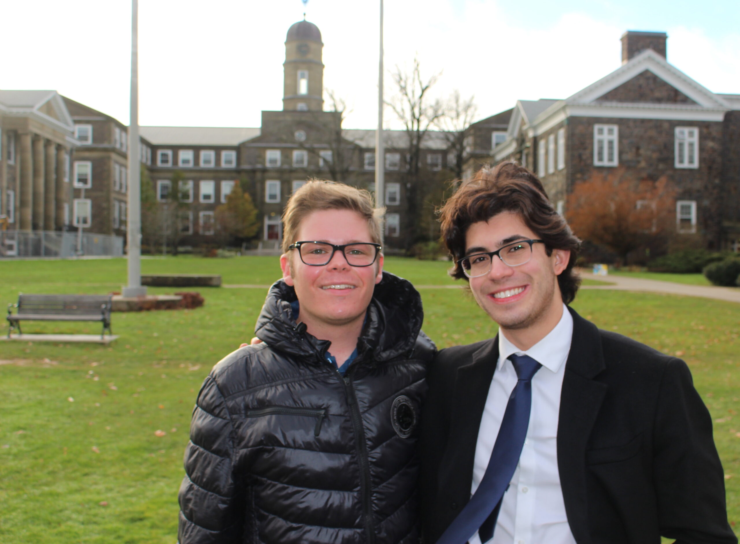 Evan Colclough (left) and Kai Jassal pose in front of the Henry Hicks building on Dalhousie campus.