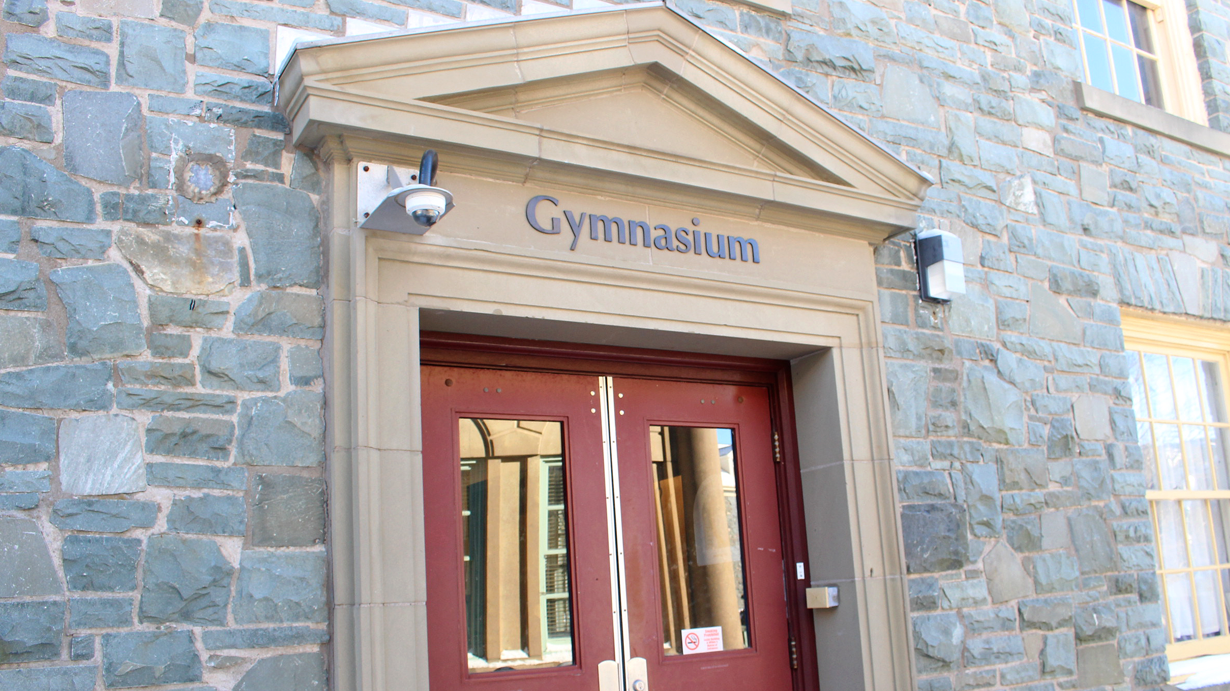 The outside of the gymnasium doors at King's.