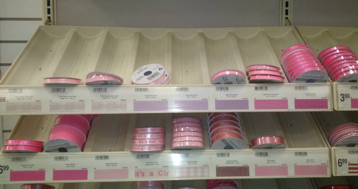 Pink ribbons on shelves