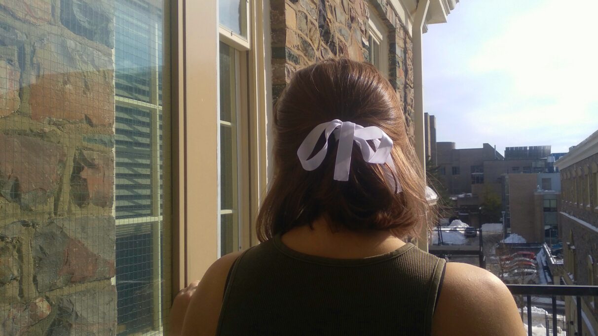 Girl with white bow in her hair