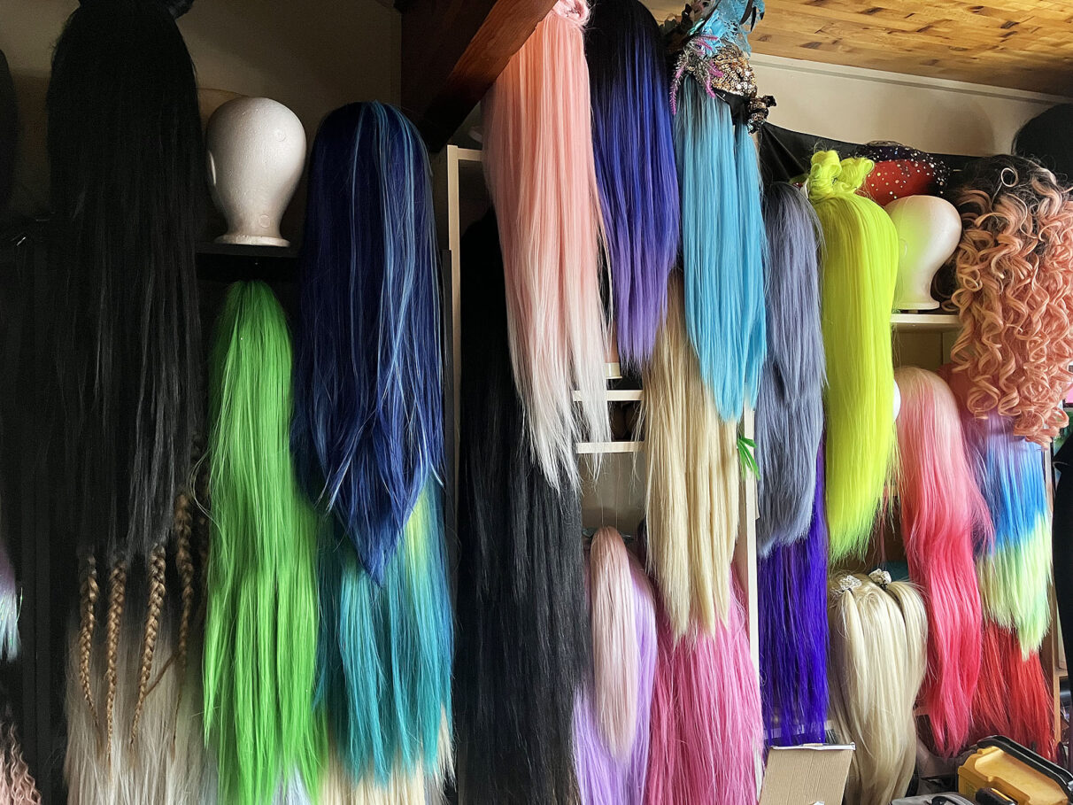 Many colours of wigs.