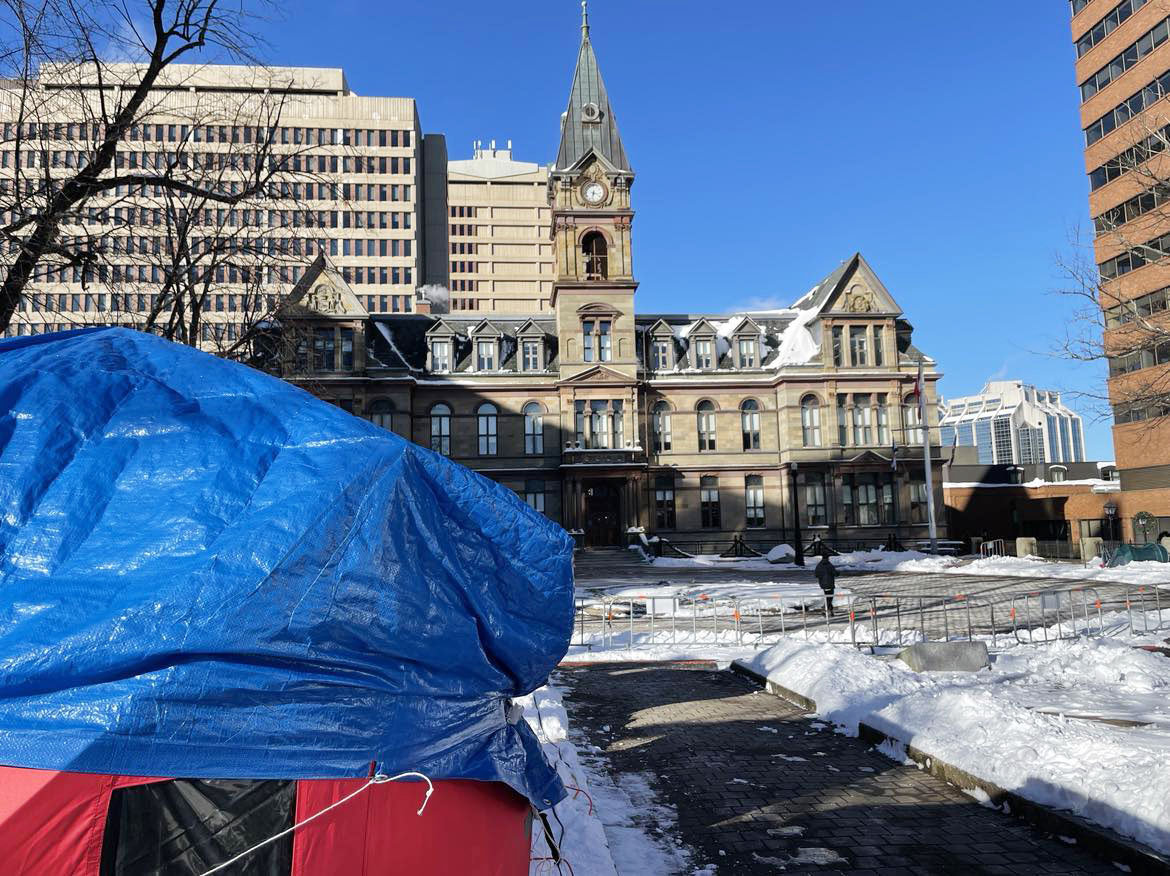 Halifax City Hall with tents in the foreground.