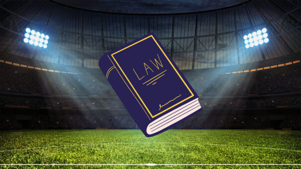 A law textbook is floating in a football field.