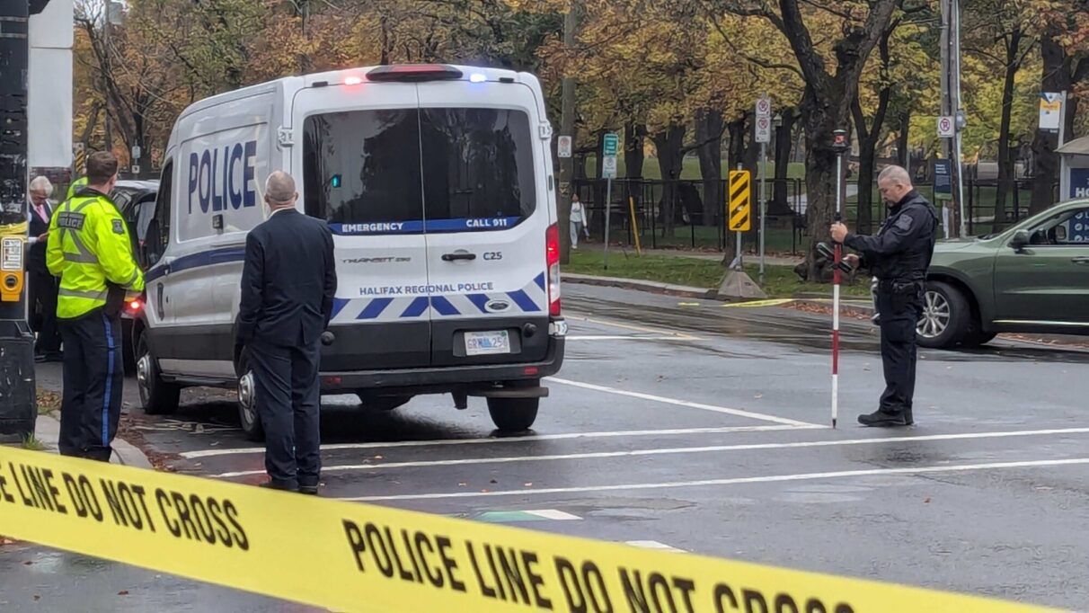 Police stand by the scene of a fatal pedestrian accident.