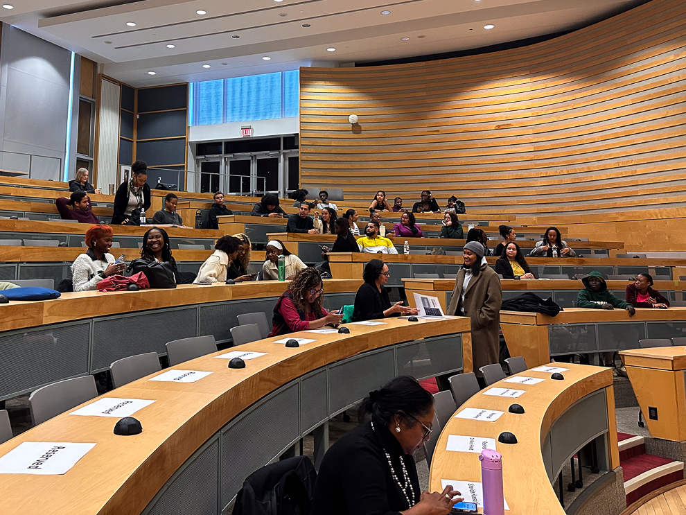 Students sitting in an auditorium.