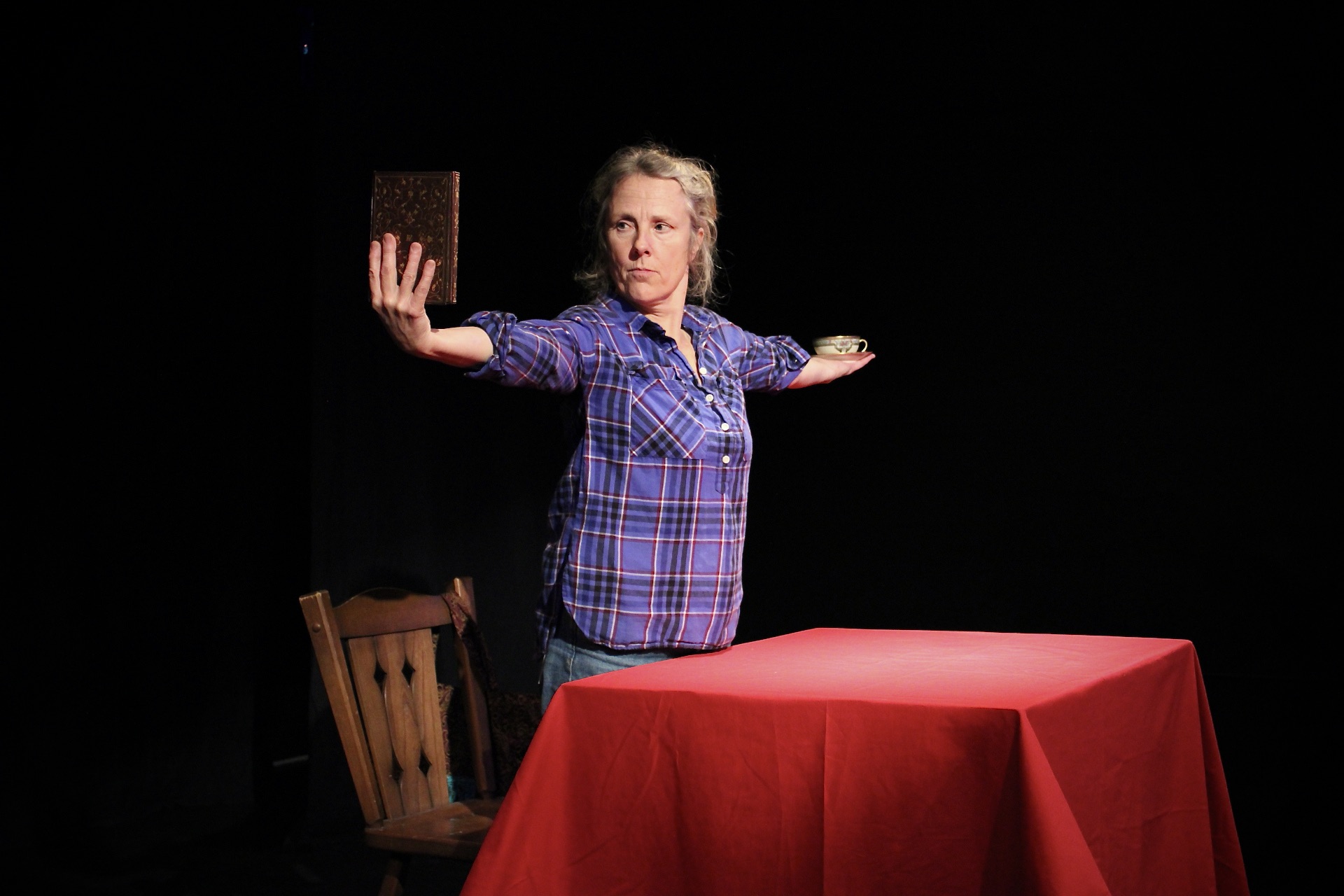 Jane Wells at the Bus Stop Theatre with items symbolizing her family in her play How To Live With Dread.