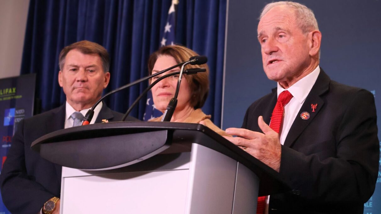 Idaho Congressman Jim Risch addresses press with the American delegation