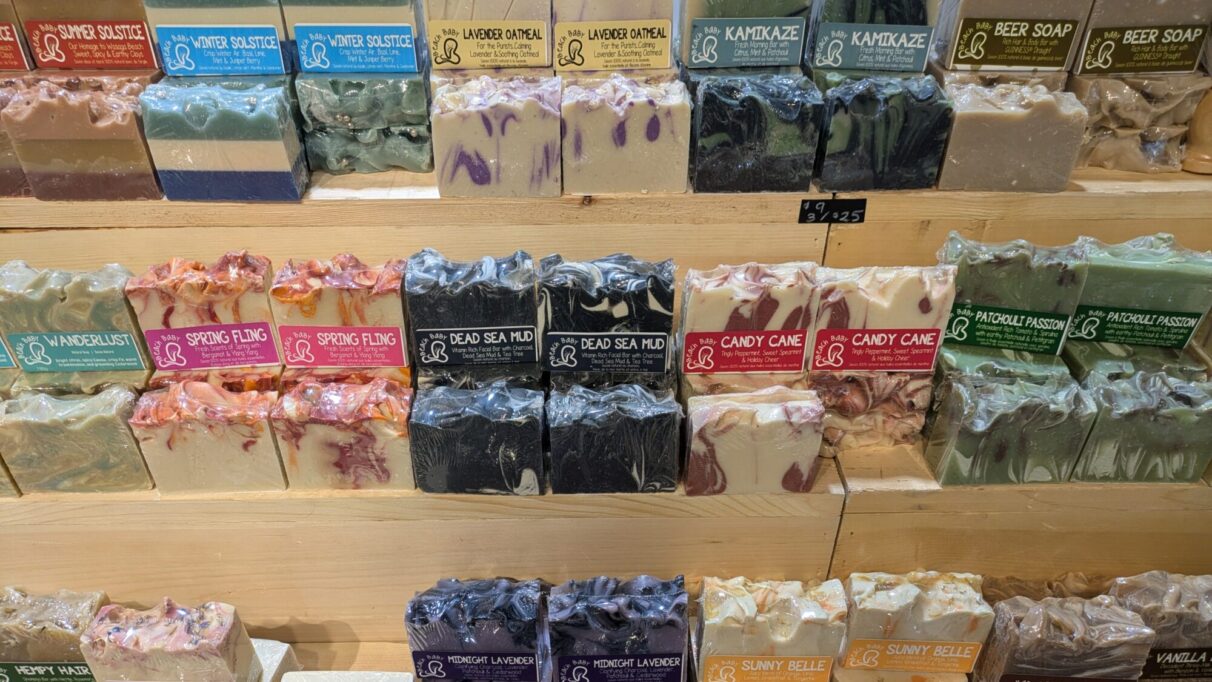 Three rows of beach baby soaps arranged on a terraced shelf