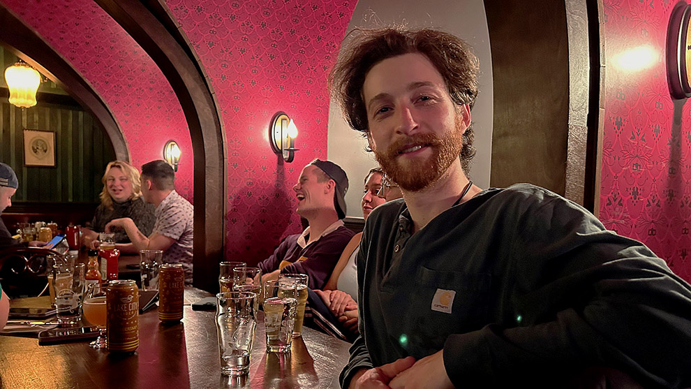 Man in bar smiles at camera