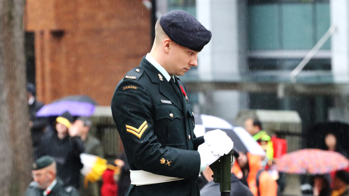 a sentry stands in the rain