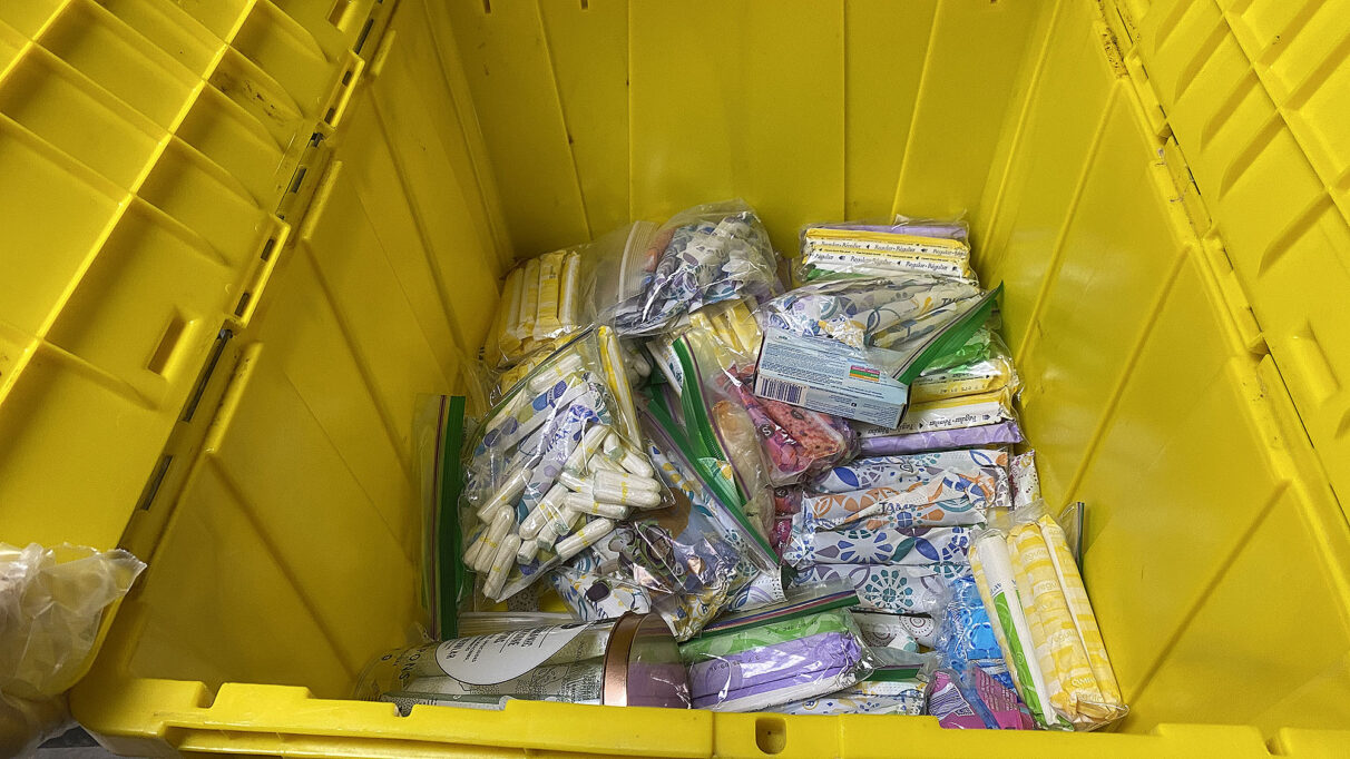 Pile of tampons in mostly empty yellow storage container