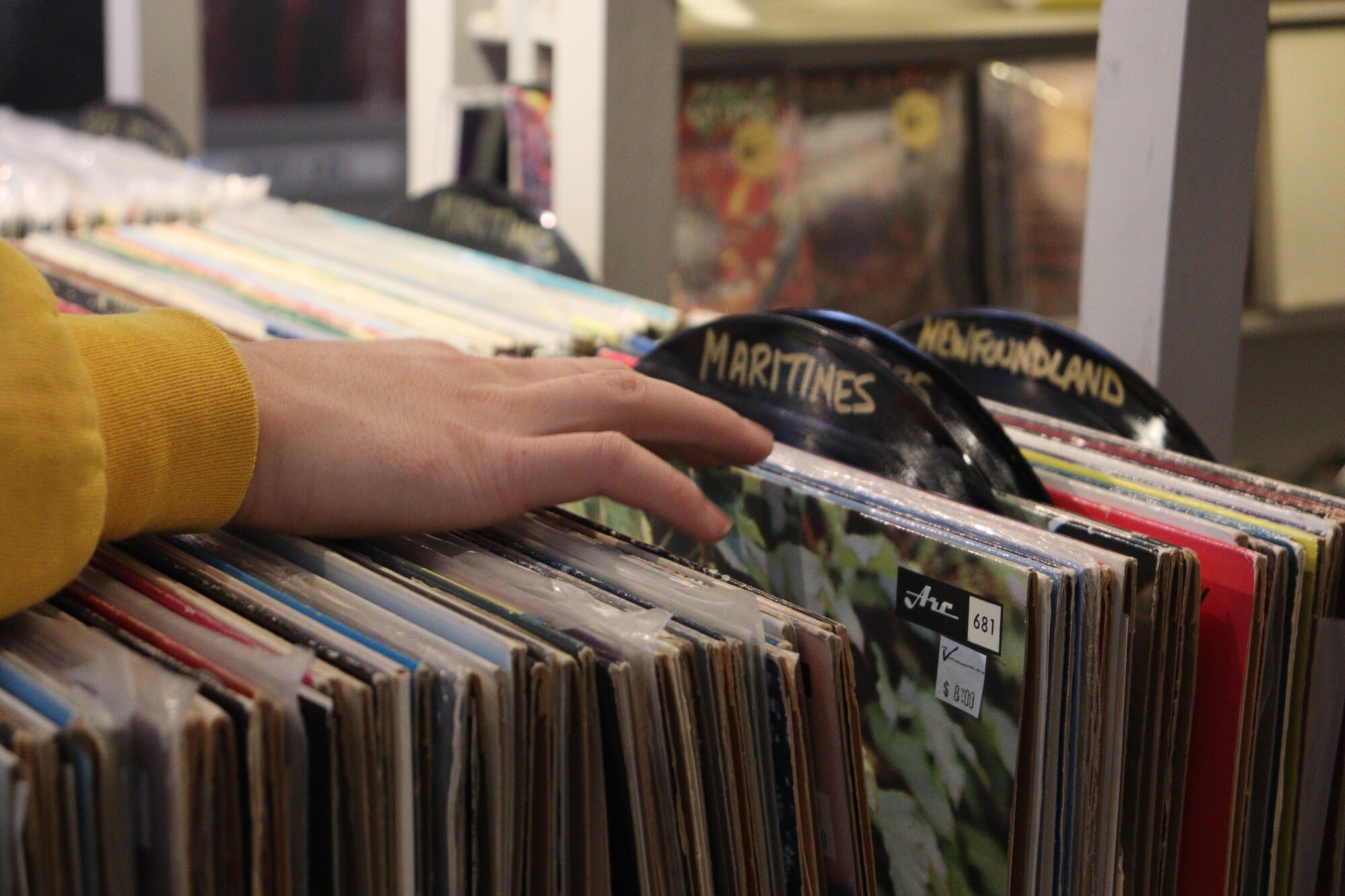 hand flicking through records