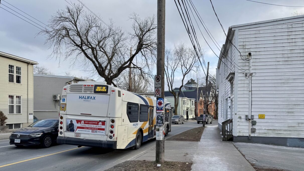 A Halifax city bus drives southbound on Robie Street towards Cunard Street.