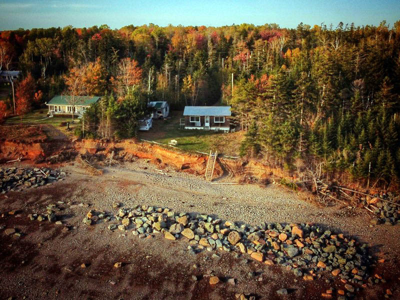 Large boulders line the shore outside Ralph Wardrope’s cottage in Bass River, N.S., part of an attempt to harden the coast against erosion.