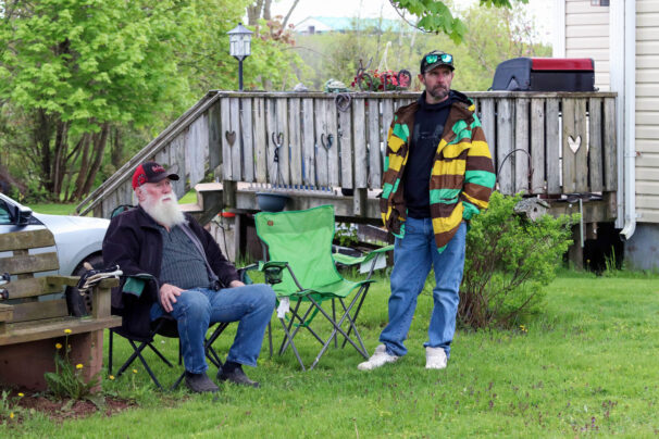 Ralph Wardrope, left, sits beside his son Tim Wardrope outside Ralph’s home in Milford, N.S.