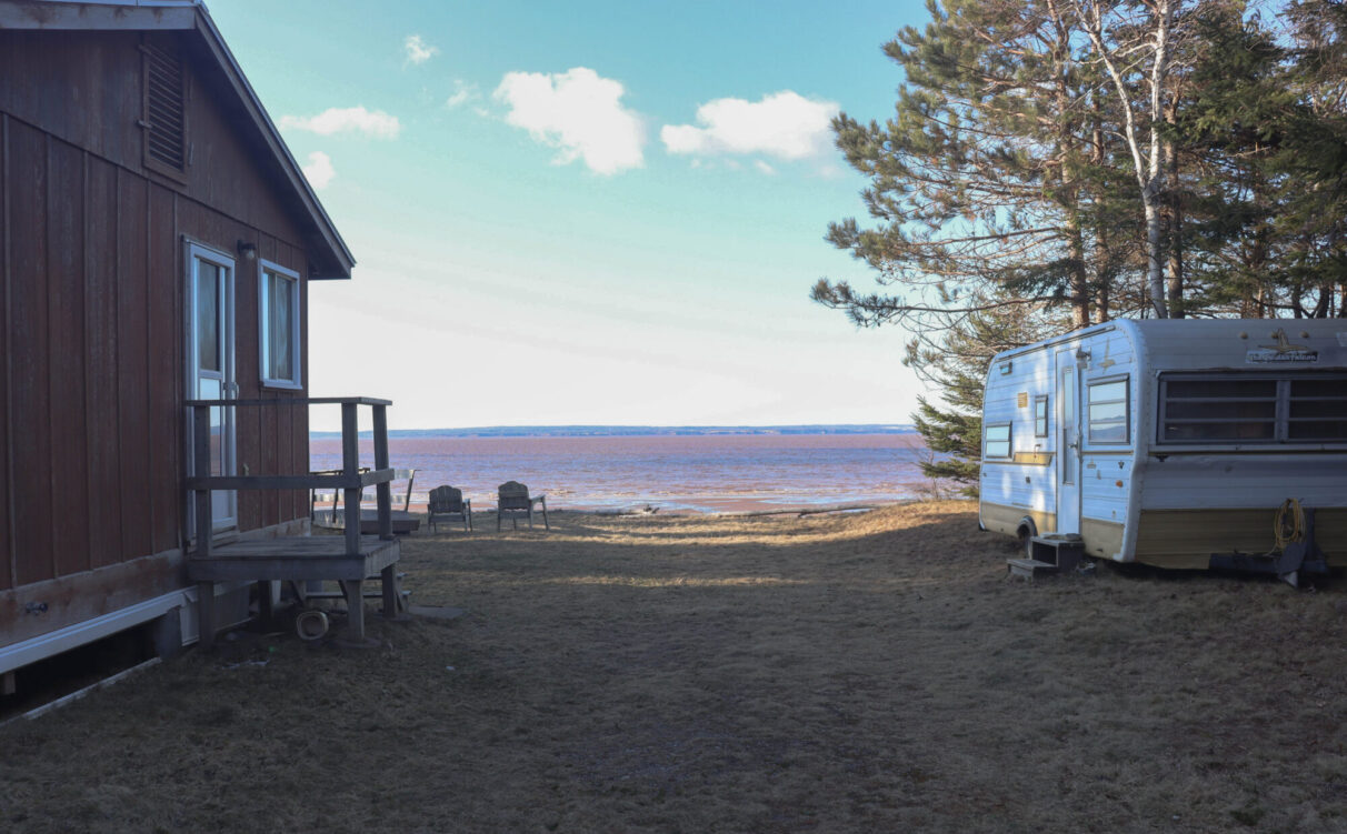 A view of the Cobequid Bay from between the cabin and trailer, at Ralph Wardrope’s property in Bass River, N.S., shows the shoreline and the Cobequid Bay beyond.