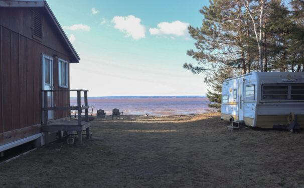 A view of the Cobequid Bay from between the cabin and trailer, at Ralph Wardrope’s property in Bass River, N.S., shows the shoreline and the Cobequid Bay beyond.