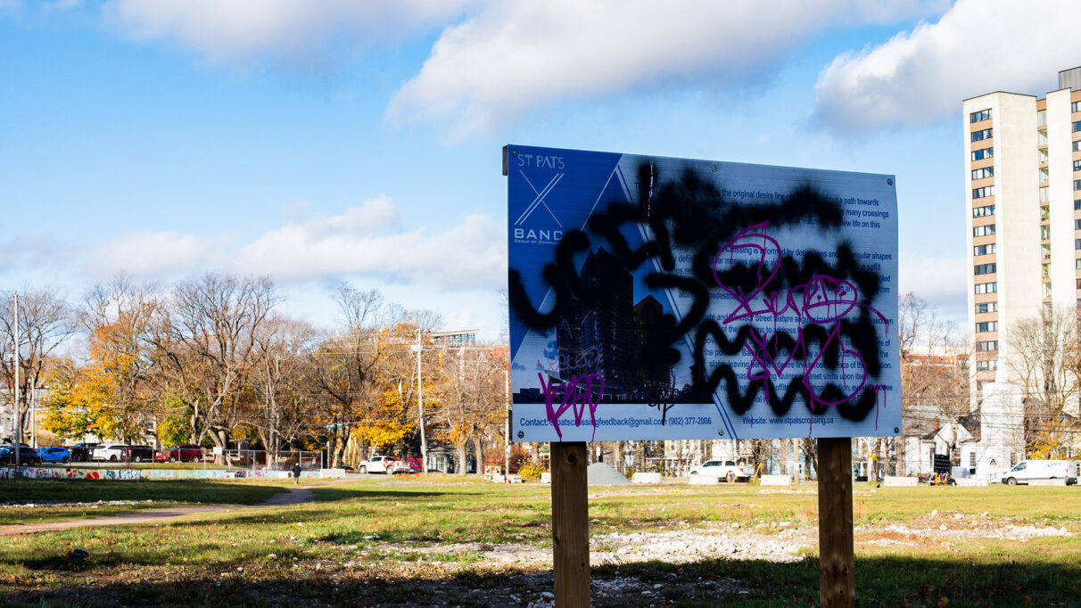 A proposal notice covered in graffiti.