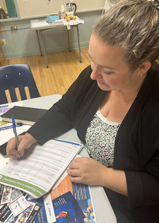 Lyndsay Foisey completes a checklist at the workshop hosted in the North Woodside Community Centre