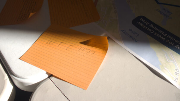 An orange post-it note that says WTF!!??