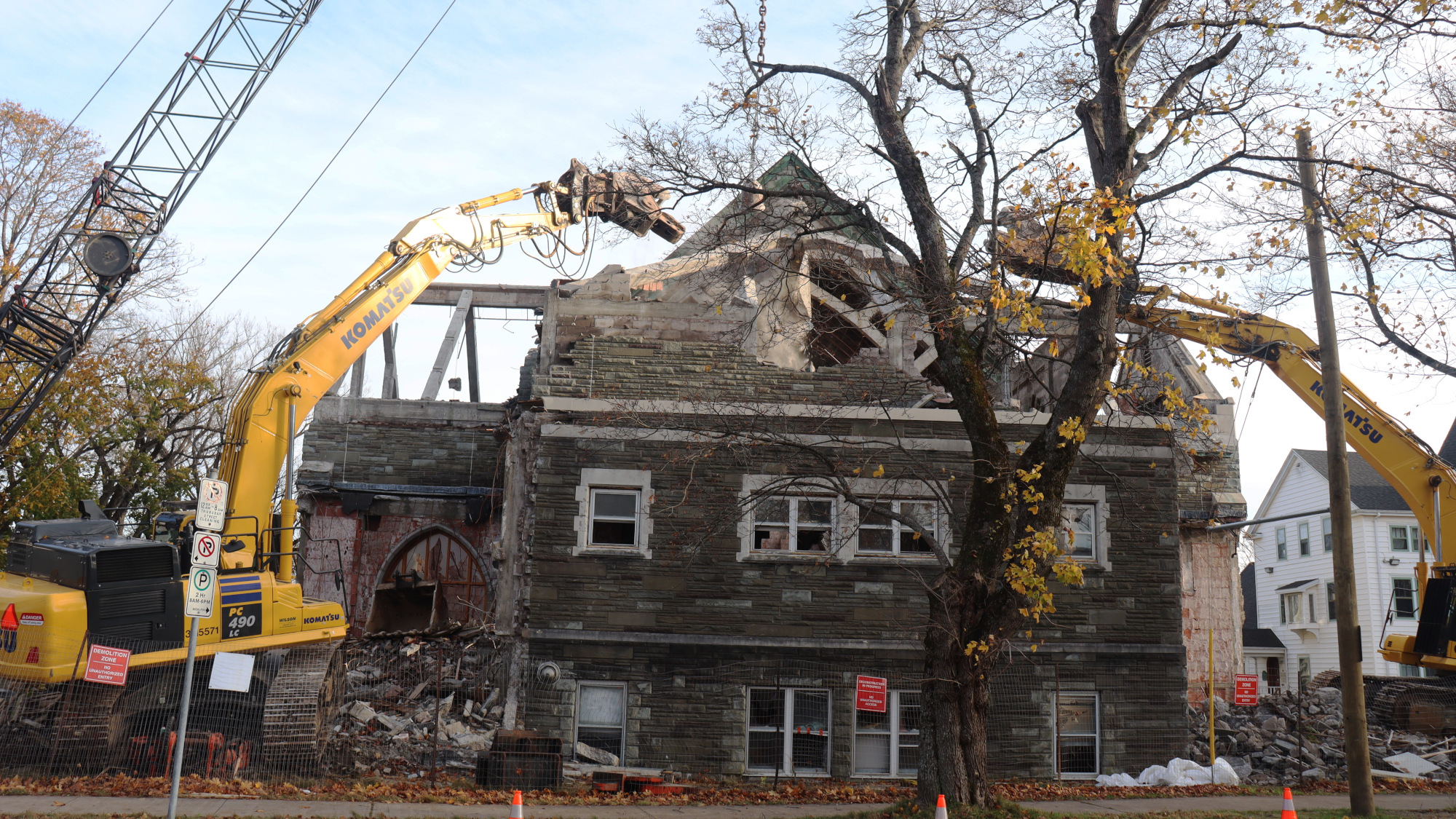 St. Theresa's church is in ruins as two diggers hold up part of a top arch.