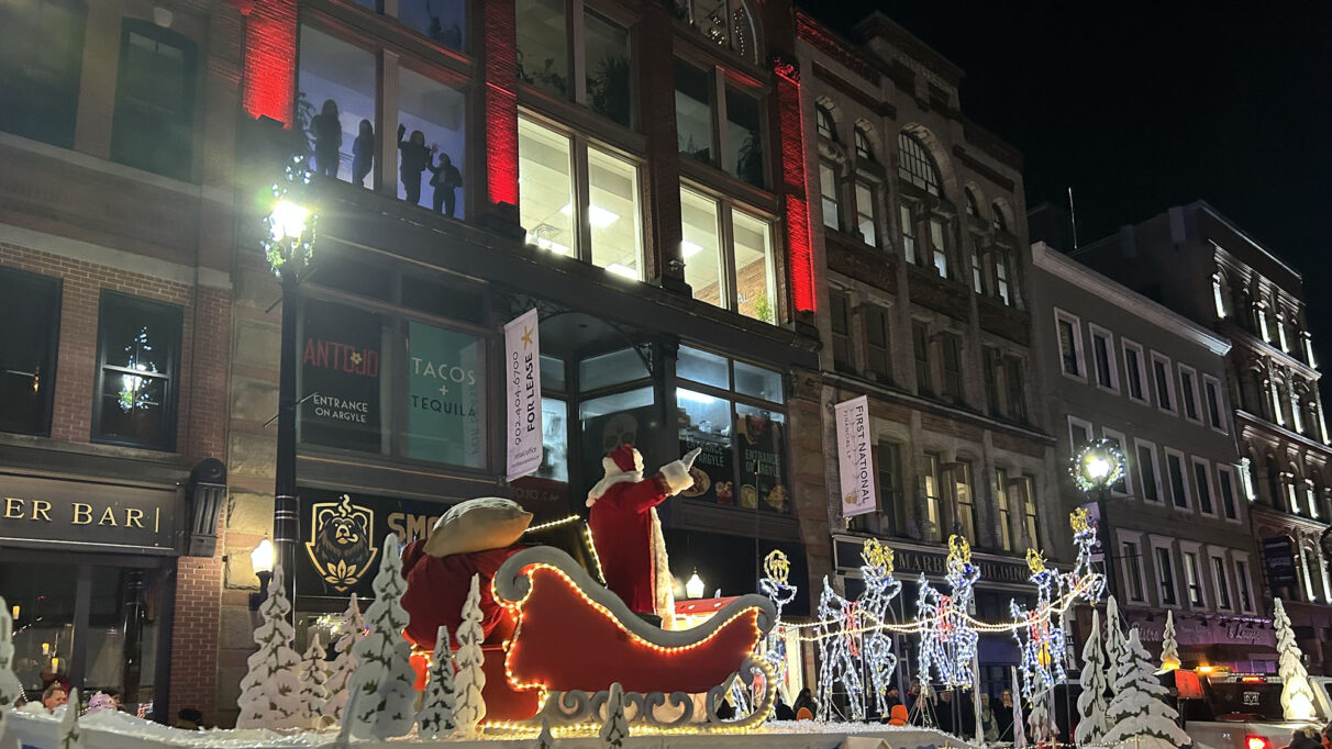Santa riding a parade float.