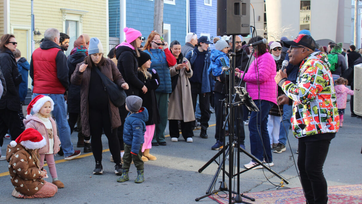 Marcell Symonds performing to a crowd at the Agricola Street Holiday Market.
