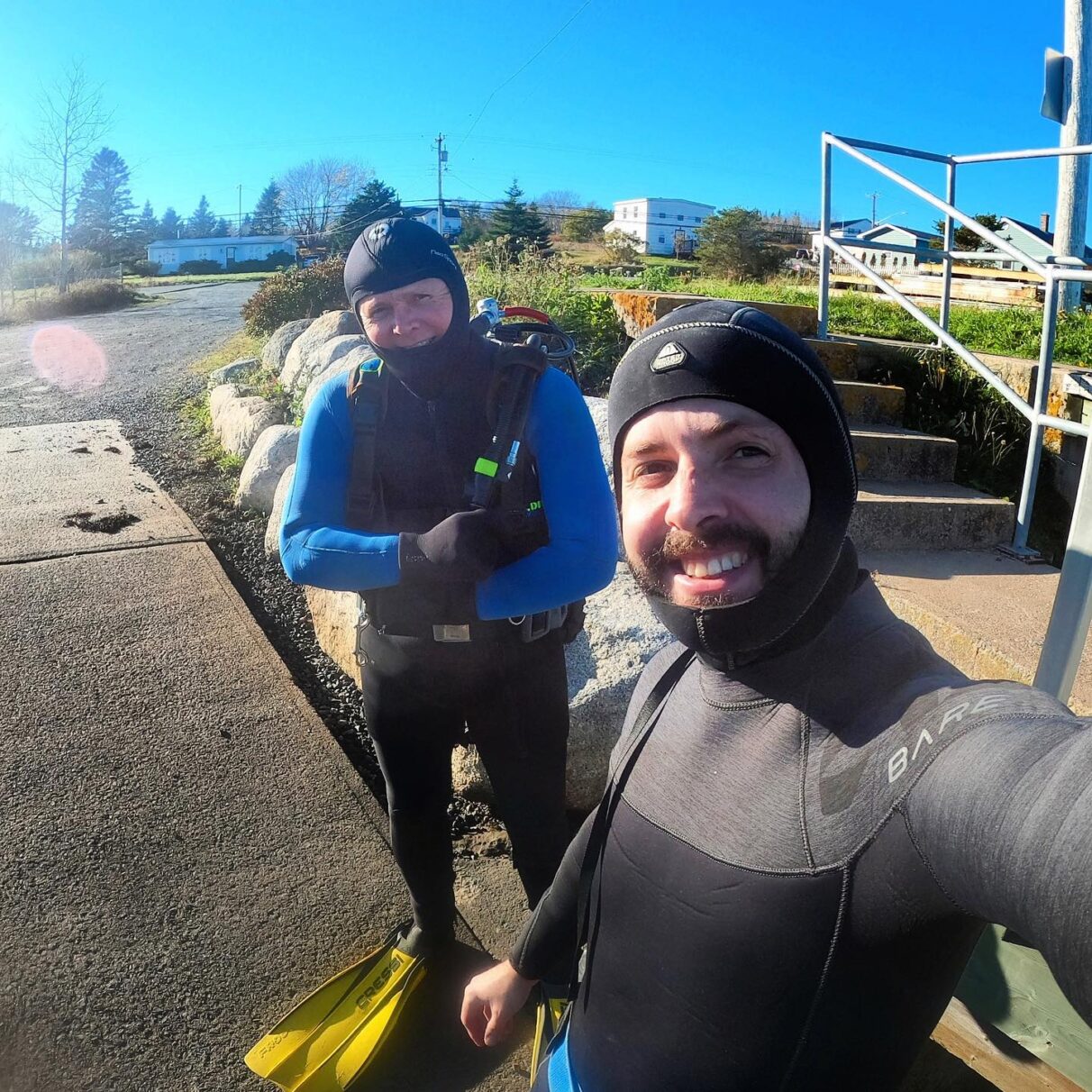 Sean McMullen and Johnathan McMullen dressed in diving gear.