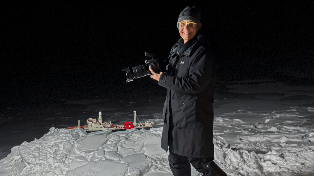Katherine Knight photographing a model of a railcar ferry for her book.