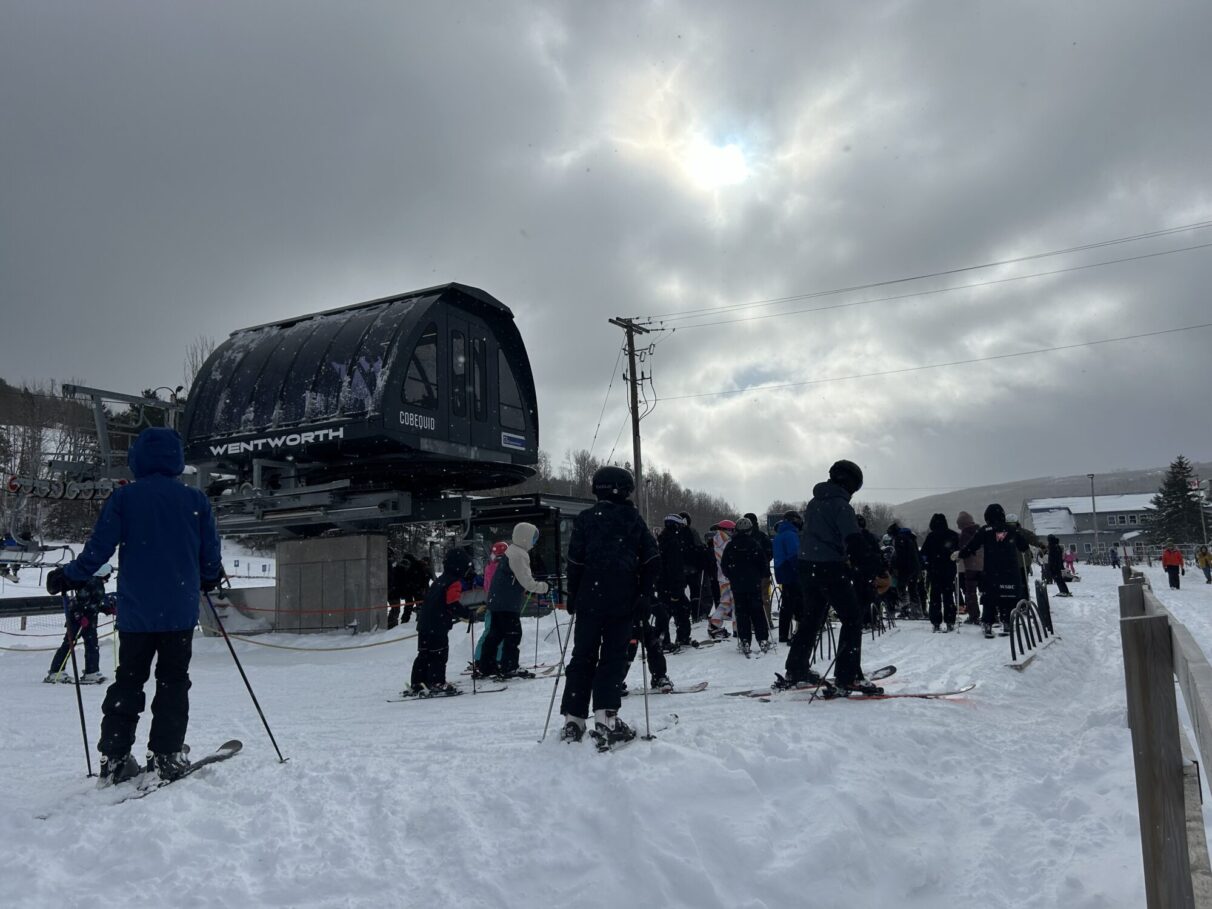 Ski hill chair lift lineup.
