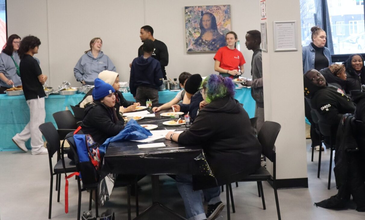 Kids are having dinner and socializing with friends and staff at the YMCA’s Anchor Youth Space during their Night of Nourishment Event.