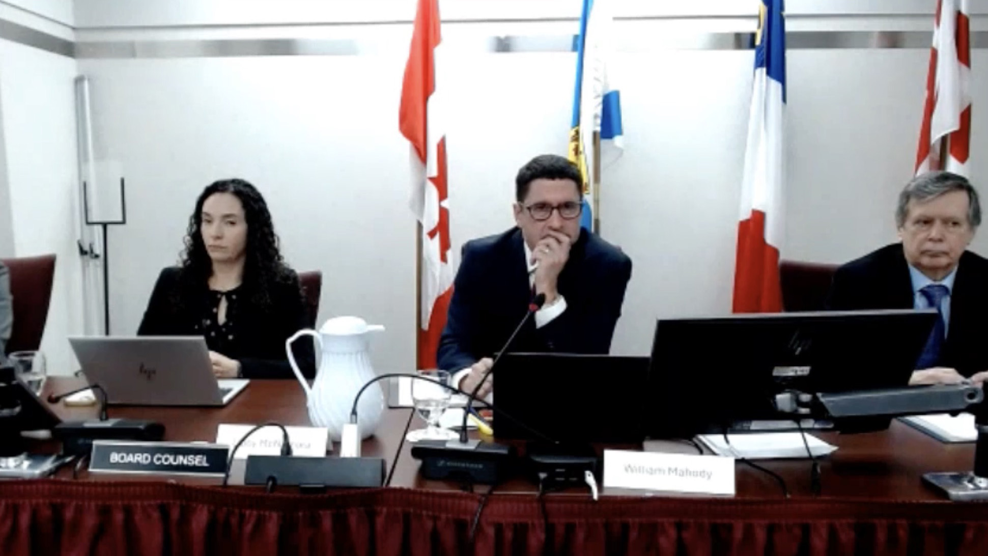 Three board council members sitting at the hearing for Nova Scotia Power's rate change application.