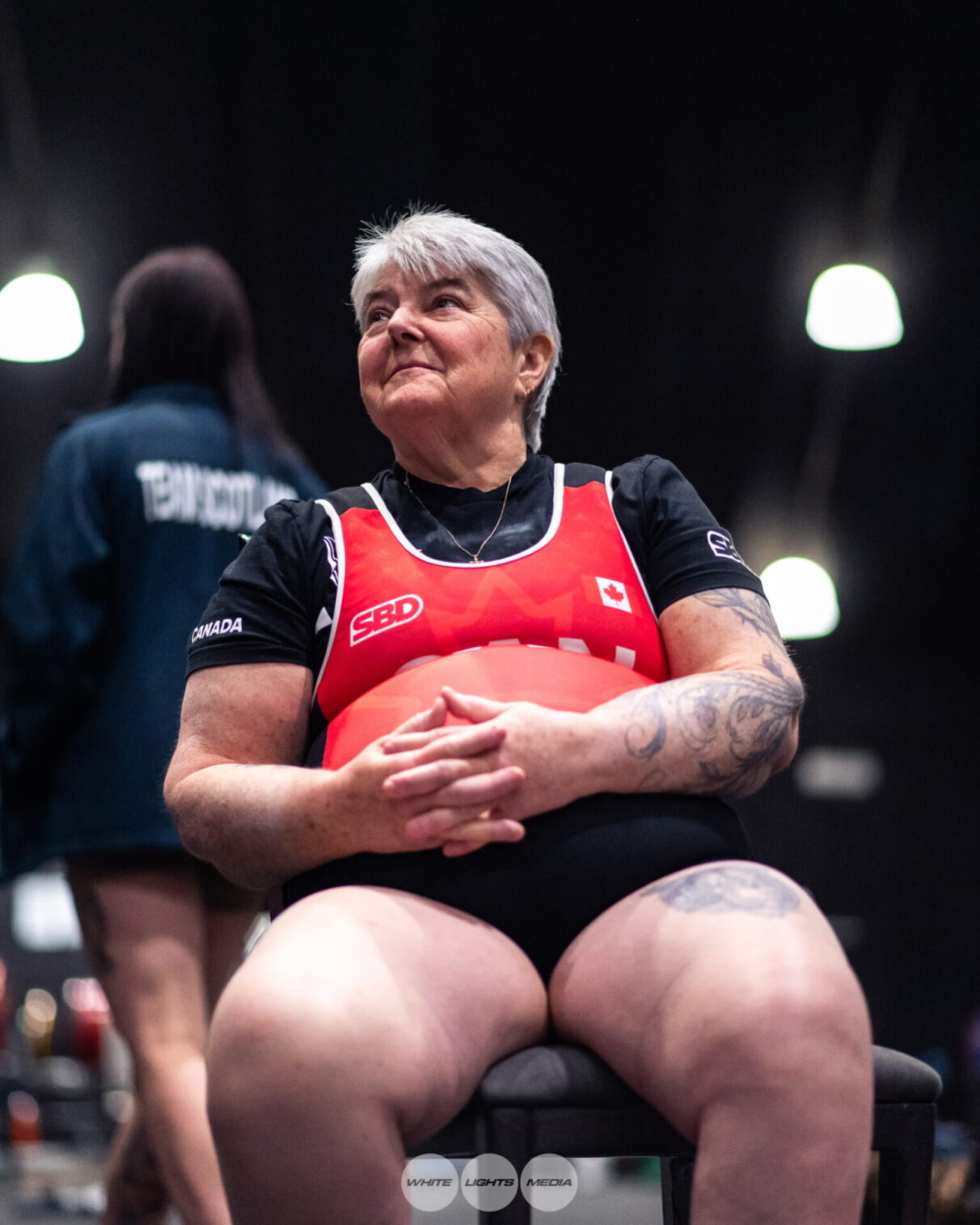 Sue Bonneau rests at the 2024 IPF World Masters Powerlifting Championships in Sun City, South Africa.